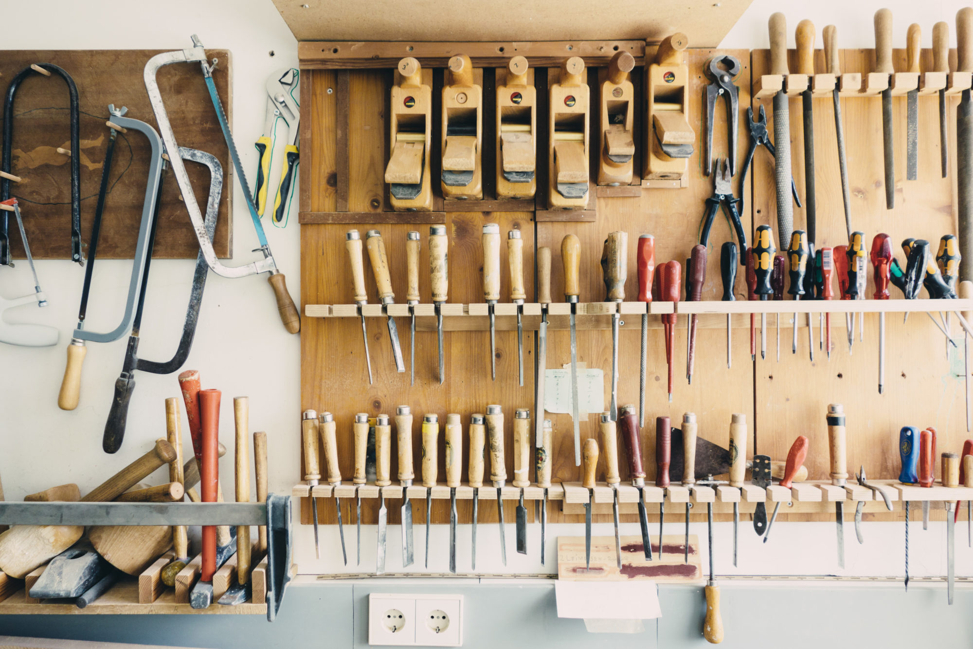 shop wall covered with woodworking tools