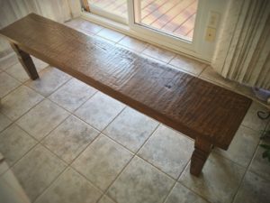 photo of a reclaimed oak dining bench.