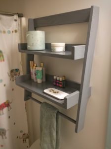 photo of finished floating ladder shelf in a bathroom