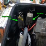 photo showing general location of the up and down trim relays on a typical outboard boat motor.